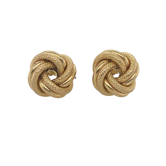 Add timeless elegance to your jewellery collection with these pre-owned 9ct yellow gold patterned knot stud earrings. Beautifully crafted with decorative detailing, these classic earrings combine meaningful symbolism with versatile everyday style.

Design: The earrings feature an attractive knot motif measuring approximately 11mm in diameter. Enhanced with a patterned finish, the intertwined design creates texture, depth, and visual interest while maintaining a refined and sophisticated appearance.