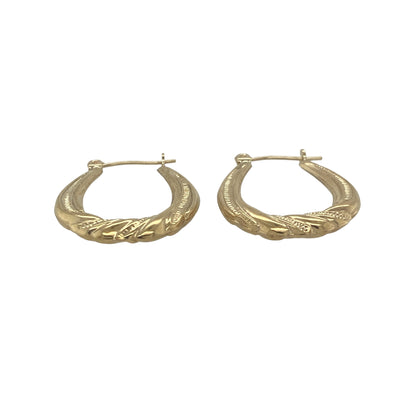 Add timeless style to your jewellery collection with these pre-owned 9ct yellow gold patterned twist oval creole earrings. Featuring elegant twisted detailing and a classic oval profile, these lightweight earrings offer versatile wear and enduring appeal.

Design: The earrings showcase a traditional oval creole shape enhanced by an attractive twisted design.