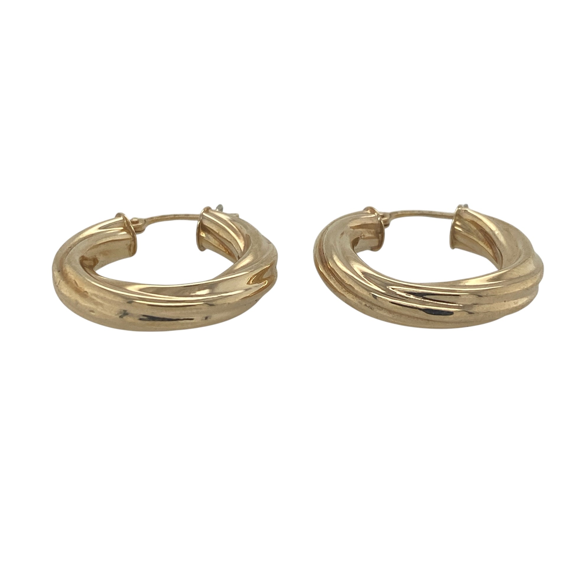 A timeless jewellery essential, these pre-owned 9ct yellow gold twisted hoop creole earrings combine classic styling with elegant detailing. Their graceful twisted design adds texture and visual interest, making them a versatile addition to any jewellery collection.

Design: The earrings feature a traditional hoop creole design enhanced by an attractive twisted profile. The flowing twist creates a beautiful interplay of light across the surface, adding depth and sophistication to the classic hoop style.