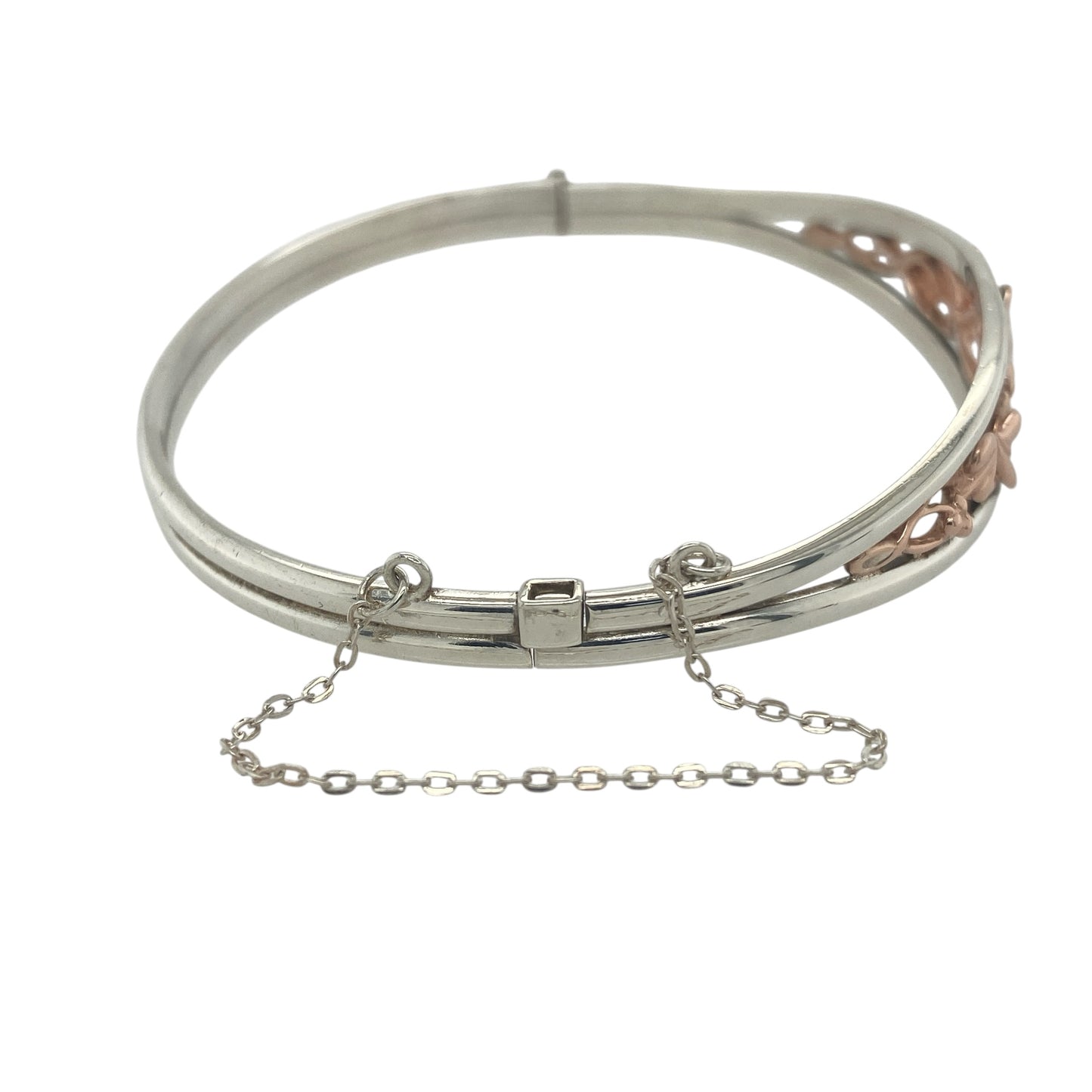 Bring timeless symbolism and elegant craftsmanship to your collection with this pre-owned 925 silver and 9ct rose gold Clogau Tree of Life bangle—perfect for adding meaningful sophistication to any look.

Design: The bangle features Clogau’s iconic Tree of Life motif across the 12mm-high front, representing growth, strength, and connection. The intricate rose gold detailing entwines beautifully with the polished silver, creating a design rich in symbolism and style.