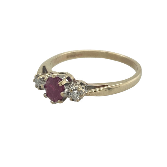 Elegant and timeless, this pre-owned 9ct yellow gold diamond and ruby trilogy ring beautifully showcases the rich colour of a natural ruby complemented by sparkling diamonds. A classic three-stone design, it makes a meaningful gift or a treasured addition to any jewellery collection.

Design: The ring features a traditional trilogy setting with a vibrant oval ruby at its centre, flanked by a sparkling diamond on either side.