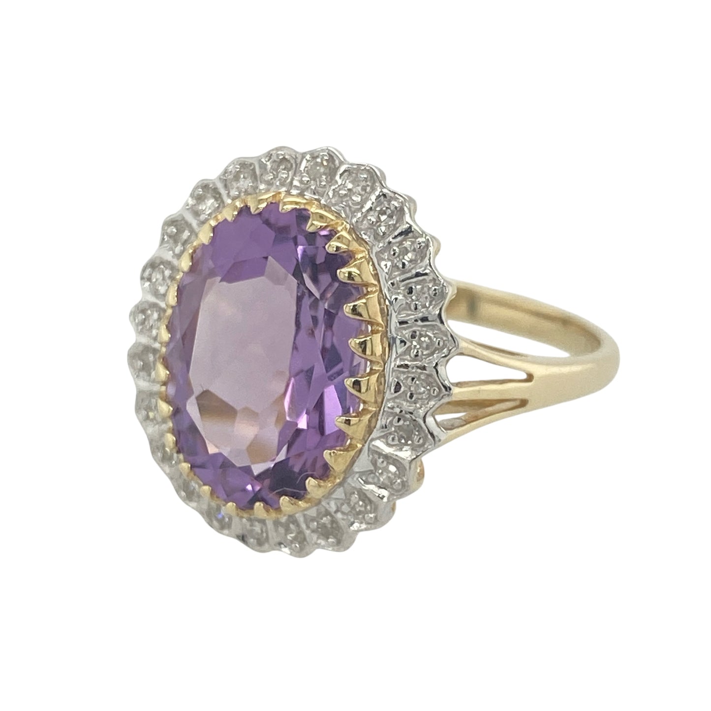 Striking and elegant, this pre-owned 9ct yellow gold diamond and amethyst cluster ring showcases a stunning large amethyst surrounded by sparkling diamonds. Combining rich colour, exceptional presence, and timeless styling, this ring is a true statement piece.

Design: The ring features a classic cluster design centred around a magnificent oval amethyst, framed by a halo of sparkling diamonds.