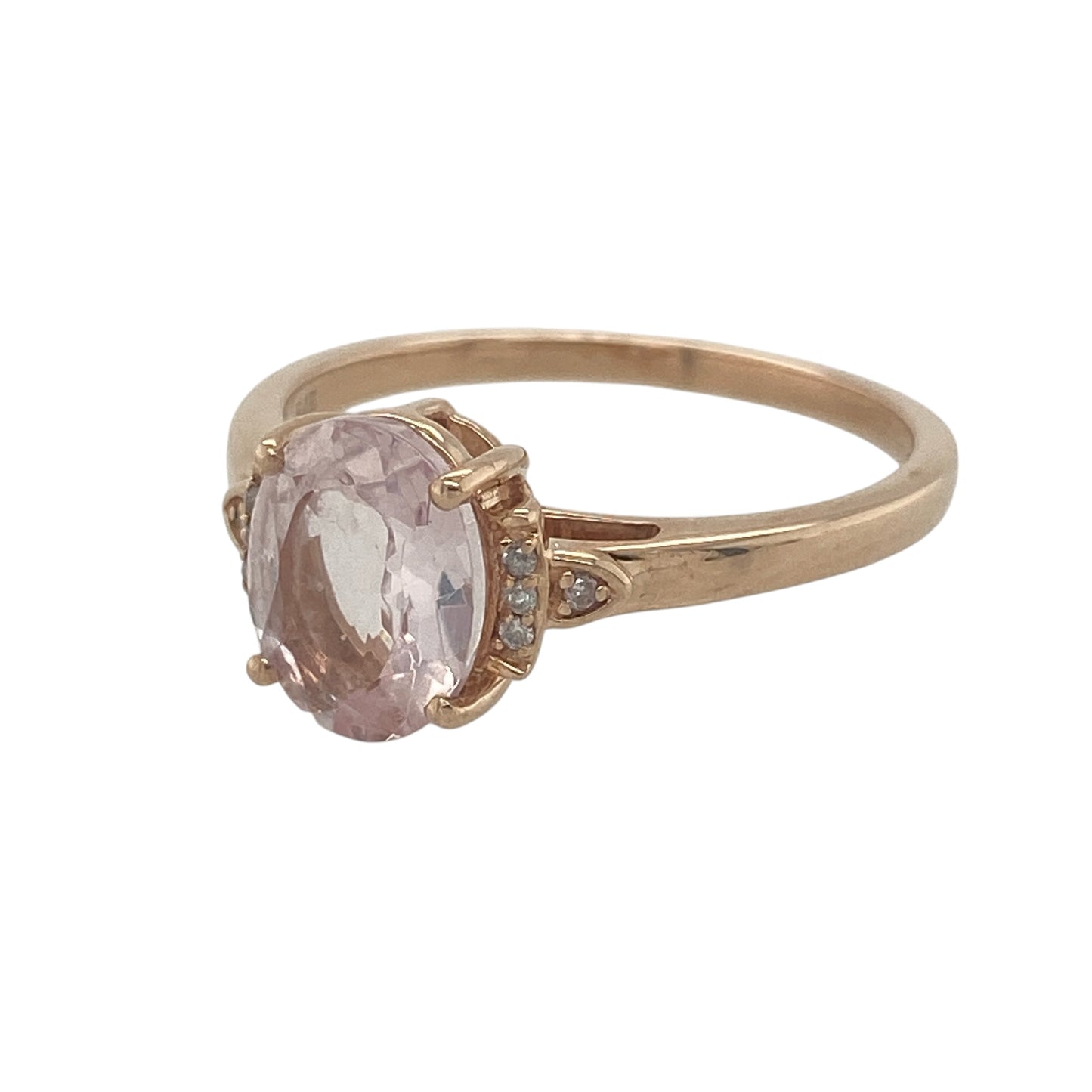 Romantic and elegant, this pre-owned 9ct rose gold diamond and morganite ring showcases the soft blush tones of morganite beautifully complemented by sparkling diamonds. Its graceful design and feminine colour palette make it a stunning addition to any jewellery collection.

Design: The ring features a classic three-stone-inspired design with an oval morganite as the centrepiece, accented by a sparkling diamond on either side.