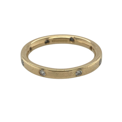Elegant and timeless, this pre-owned 18ct yellow gold diamond band ring offers understated luxury with sparkling diamonds beautifully spaced around the entire band. Crafted in rich 18-carat gold, it is a versatile piece perfect for everyday wear, stacking, or marking a special occasion.

Design: The ring features a slender and refined band with eight diamonds set at equal intervals around the circumference, creating a balanced and attractive design that sparkles from every angle.