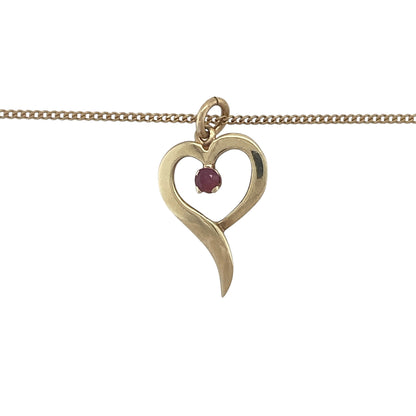 Romantic and elegant, this pre-owned 9ct yellow gold ruby open heart pendant necklace beautifully combines the timeless symbol of love with the rich colour of a natural ruby. Its graceful design makes it a meaningful piece for everyday wear or a thoughtful gift for someone special.

Design: The necklace features an elegant open heart pendant measuring approximately 2.2cm in length, including the bail.