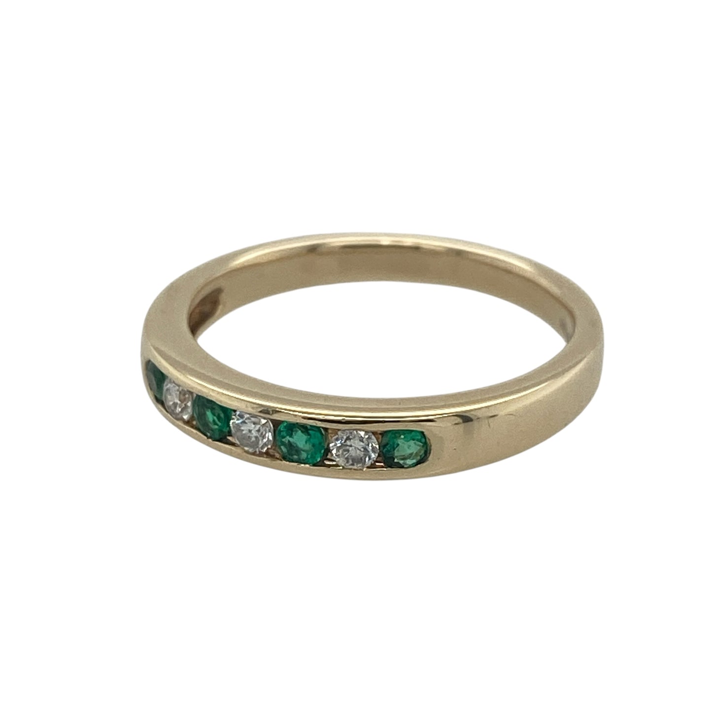 Elegant and timeless, this pre-owned 9ct yellow gold diamond and emerald band ring beautifully combines the rich green colour of emeralds with the sparkle of diamonds. Its refined profile makes it an ideal choice for everyday wear while adding a touch of classic luxury to any jewellery collection.

Design: The ring features a graceful band design with alternating emeralds and diamonds across the front, creating a beautifully balanced combination of vibrant colour and sparkling brilliance.