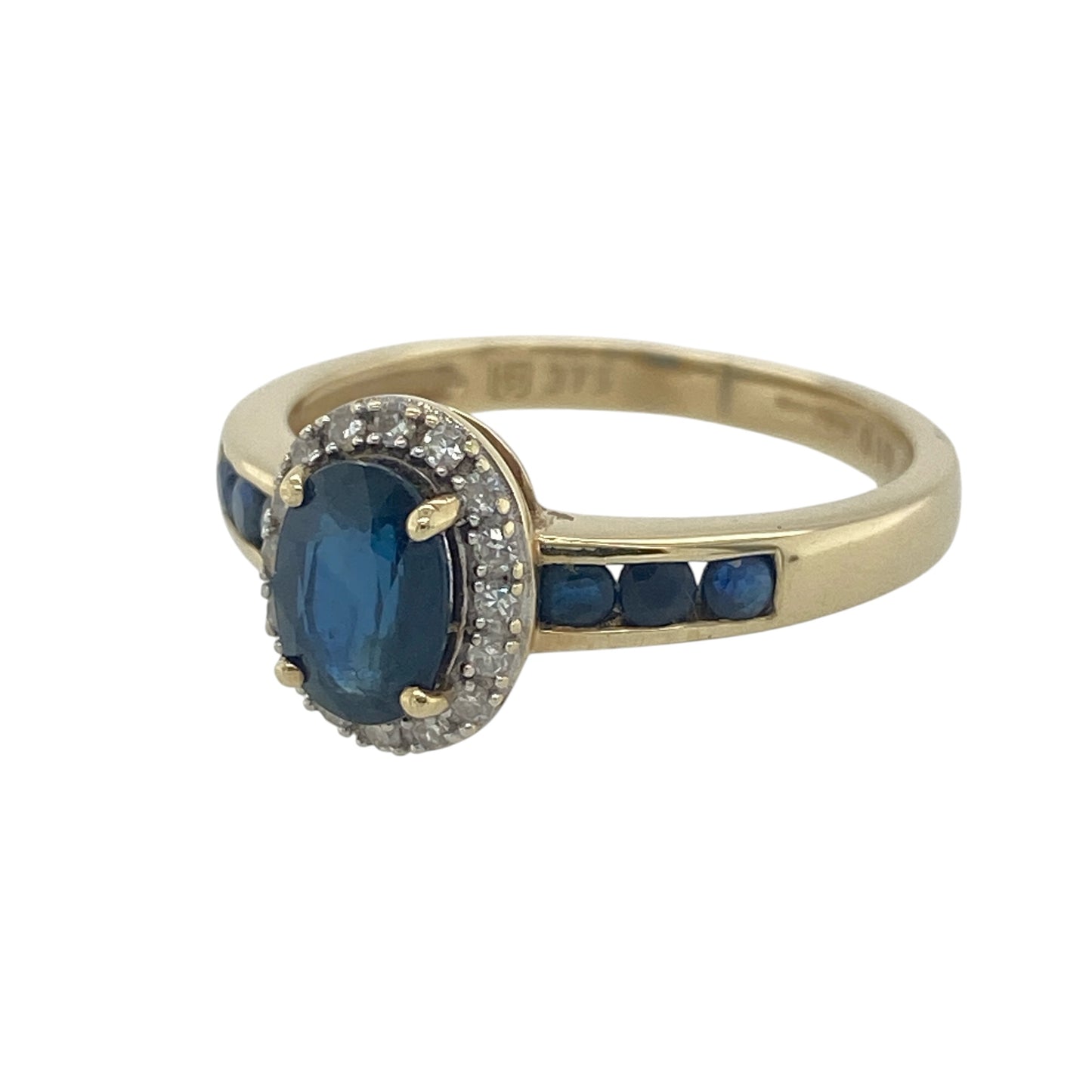 Elegant and beautifully detailed, this pre-owned 9ct yellow gold diamond and sapphire cluster ring is a timeless design that showcases the rich beauty of sapphires alongside the brilliance of sparkling diamonds. With additional sapphire accents on the shoulders, this striking ring offers colour, sparkle, and classic sophistication.

Design: The ring features a stunning oval sapphire at its centre, surrounded by a halo of sparkling diamonds to create a traditional cluster design.