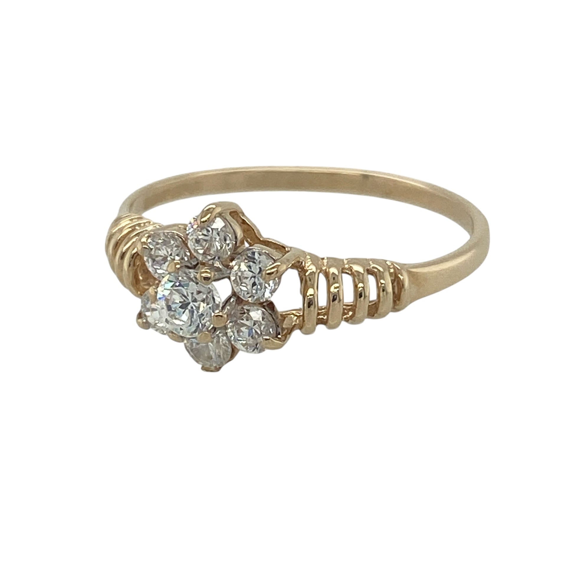 Delicate and feminine, this pre-owned 9ct yellow gold cubic zirconia flower cluster ring is a charming piece that combines sparkling stones with beautifully textured detailing. Its floral-inspired design creates a timeless look, perfect for everyday elegance or special occasions.

Design: The ring features a pretty flower cluster design measuring approximately 9mm in height across the front. Sparkling cubic zirconia stones are arranged to form an elegant floral motif, creating a dazzling focal point.