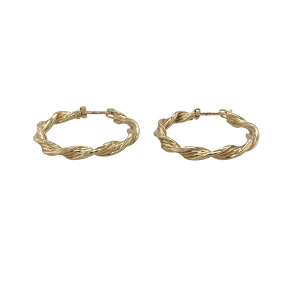 Classic with a contemporary twist, these pre-owned 9ct yellow gold twisted hoop creole earrings are a timeless jewellery essential. Their elegant twisted profile adds texture and light-catching detail to the traditional hoop design, making them a versatile choice for both everyday wear and special occasions.

Design: The earrings feature a classic hoop creole silhouette with a beautifully twisted finish that creates added depth and visual interes.