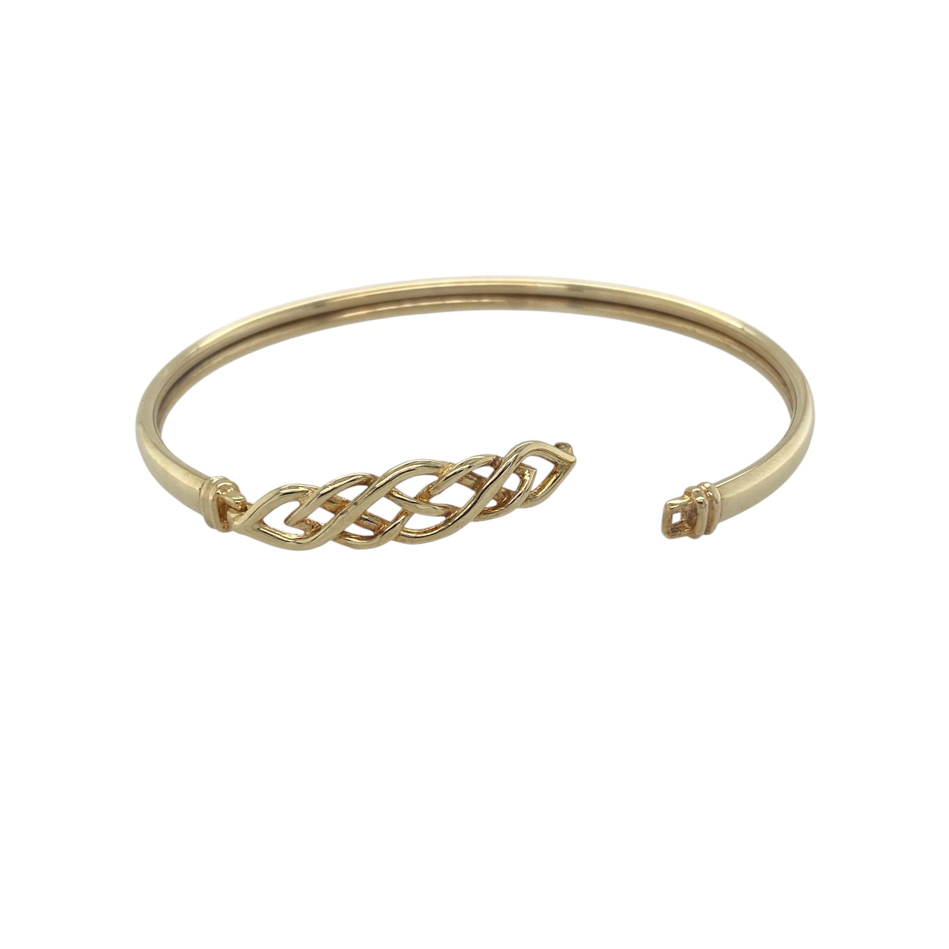 Elegant and rich in symbolism, this pre-owned 9ct yellow gold Celtic knot bangle is a timeless piece inspired by traditional Celtic artistry. Featuring an intricate knotwork design across the front, it beautifully represents eternity, unity, and everlasting connection, making it both a meaningful accessory and a stylish addition to any jewellery collection.

Design: The bangle showcases an intricate Celtic knot motif across the front, measuring approximately 7mm in height.