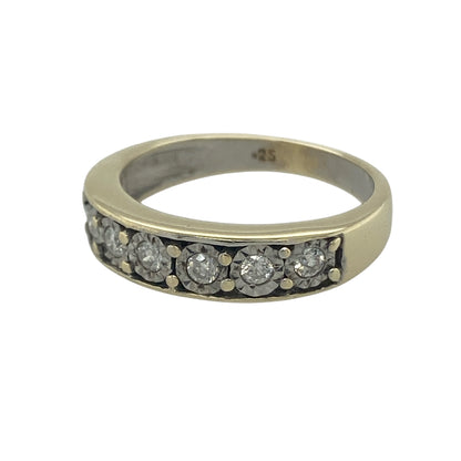 Elegant and timeless, this pre-owned 9ct yellow gold diamond band ring showcases a row of sparkling illusion-set diamonds, offering the appearance of larger stones with exceptional brilliance. With its substantial band and classic styling, it is a beautiful choice for everyday wear, an anniversary gift, or a meaningful addition to any jewellery collection.

Design: The ring features a classic diamond band design with seven illusion-set diamonds across the front.