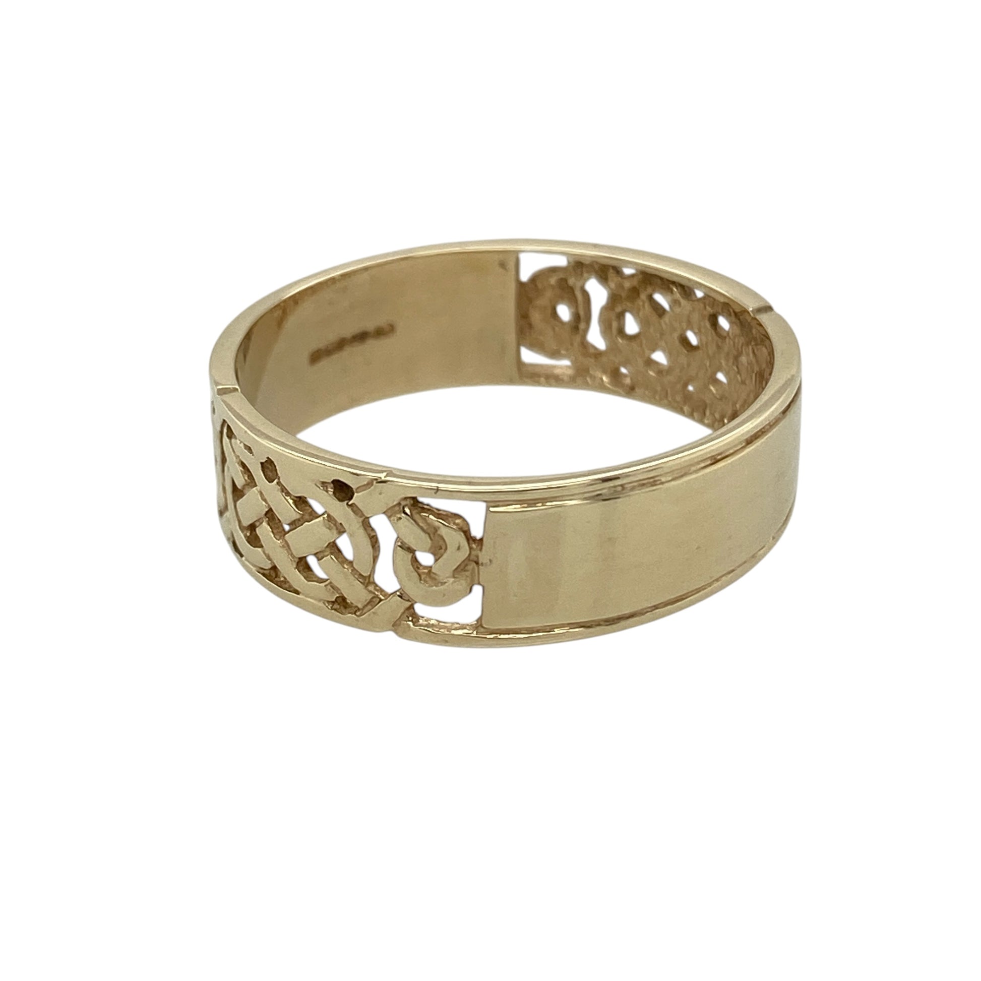 Bring timeless heritage and distinctive style to your jewellery collection with this pre-owned 9ct yellow gold open Celtic band ring, featuring an intricate patterned design inspired by traditional Celtic knotwork—perfect for everyday wear or as a meaningful gift.

Design: The ring features a 6mm wide band with two beautifully patterned open Celtic sections, separated by a polished solid gold band through the centre.