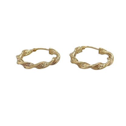 Add timeless style to your jewellery collection with these pre-owned 9ct yellow gold twisted hoop Creole earrings, featuring an elegant twisted design that offers a modern take on a classic hoop—perfect for everyday wear or dressing up any outfit.

Design: The earrings feature a traditional Creole hoop shape with an attractive twisted finish, creating added texture and light-catching detail for a stylish and versatile look.