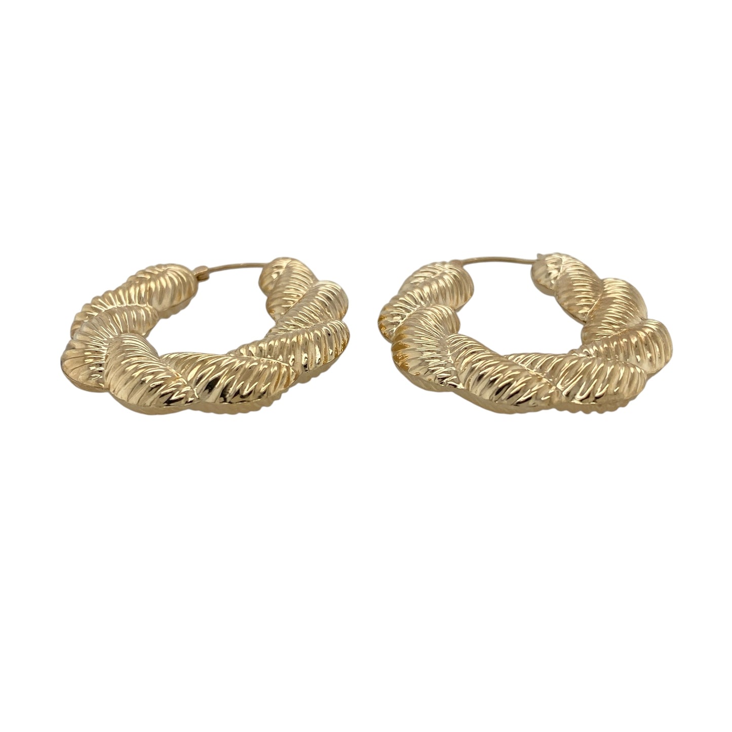 Make a statement with these pre-owned 9ct gold large plaited textured twisted oval Creole earrings, featuring an eye-catching combination of bold proportions and intricate detailing that brings timeless elegance to any jewellery collection.

Design: The earrings feature a large oval Creole hoop design with an attractive plaited, textured and twisted finish. The combination of detailed textures creates a striking light-catching effect, giving these earrings a bold yet sophisticated appearance.