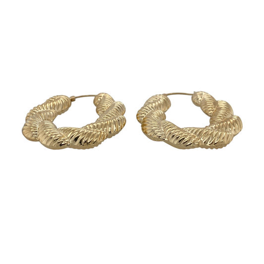 Make a statement with these pre-owned 9ct gold large plaited textured twisted oval Creole earrings, featuring an eye-catching combination of bold proportions and intricate detailing that brings timeless elegance to any jewellery collection.

Design: The earrings feature a large oval Creole hoop design with an attractive plaited, textured and twisted finish. The combination of detailed textures creates a striking light-catching effect, giving these earrings a bold yet sophisticated appearance.