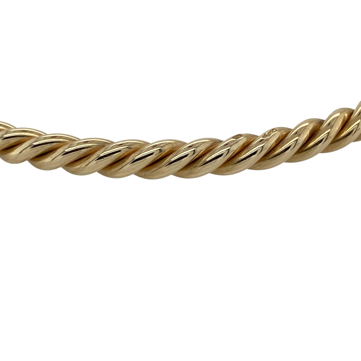 Make a timeless statement with this pre-owned 9ct solid yellow gold twisted torque bangle, featuring a classic open torque design with elegant twisted detailing that is perfect for both everyday wear and special occasions.

Design: The bangle features a traditional open torque style with a beautifully twisted profile, creating texture and a light-catching finish that enhances its timeless appeal. The 4mm wide design offers a bold yet elegant look that can be worn alone or layered with other bracelets.