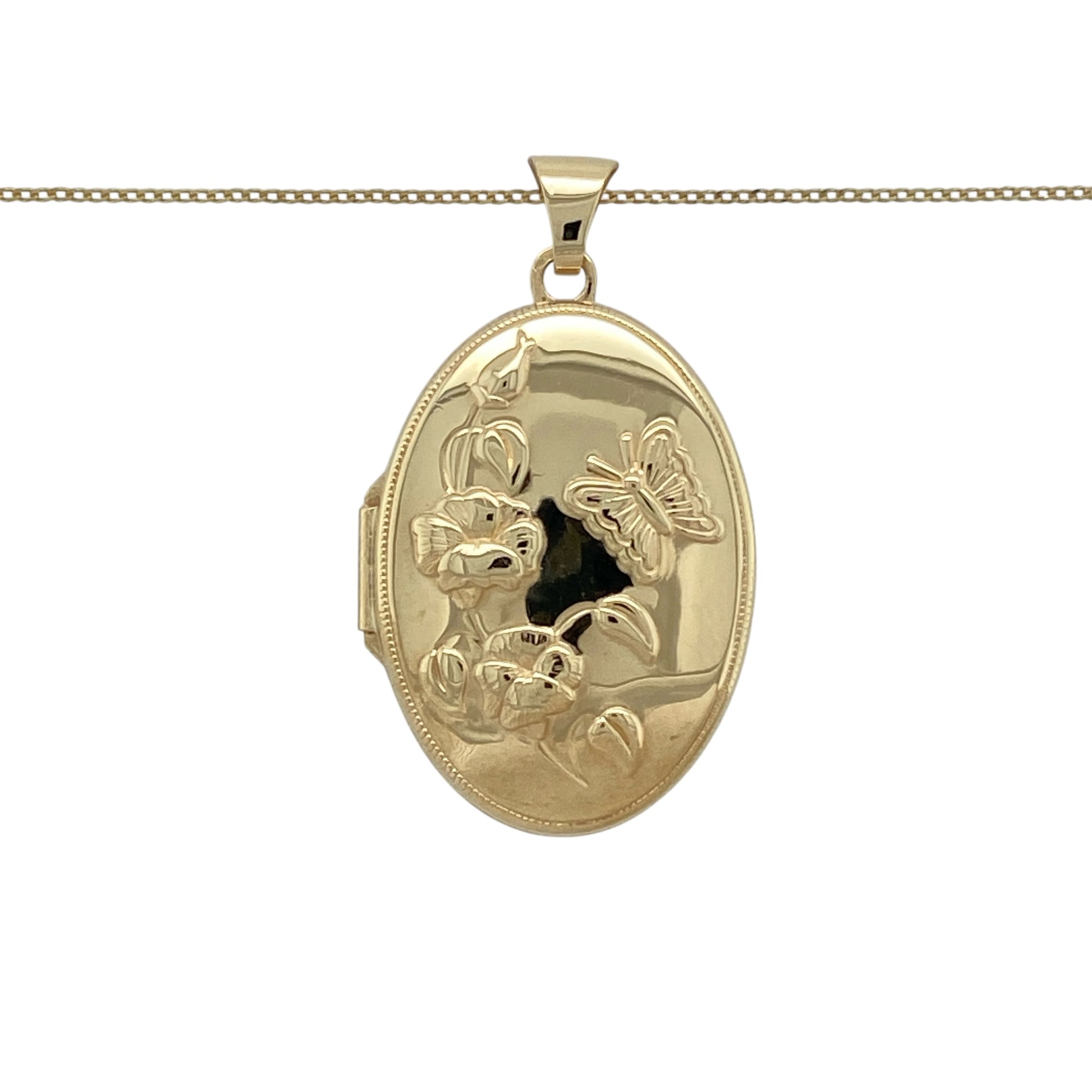 Keep treasured memories close with this pre-owned 9ct yellow gold oval flower and butterfly locket necklace, featuring a beautifully detailed design suspended from a classic 20-inch fine curb chain.

Design: The necklace features an elegant oval locket decorated with delicate flower and butterfly detailing, creating a timeless and sentimental piece. Measuring approximately 3.4cm long including the bail, the locket makes a graceful statement while offering space inside for cherished photographs or keepsakes.