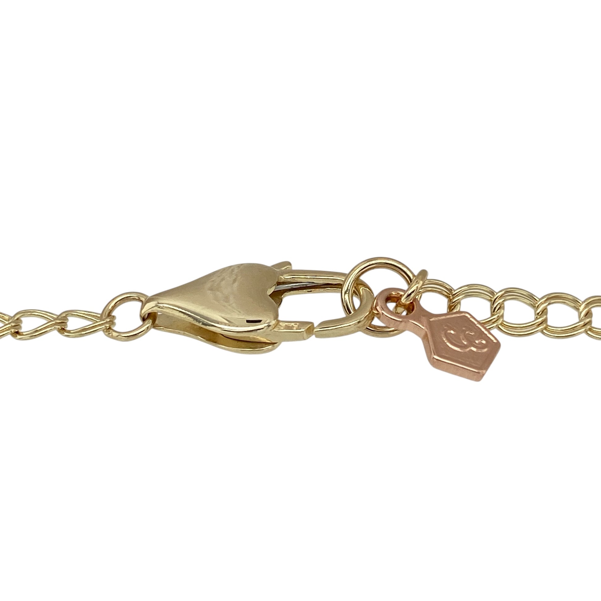 Bring romantic charm and elegant detail to your collection with this pre-owned Clogau Cariad bracelet in 9ct yellow and rose gold—a meaningful design inspired by love.

Design: The bracelet features 5mm wide links with alternating yellow and rose gold tones, detailed with the word “Cariad,” the Welsh word for “Love,” for a symbolic finish.
Material: Made from 9-carat yellow and rose gold, the polished surfaces highlight the warmth of the two-tone design.