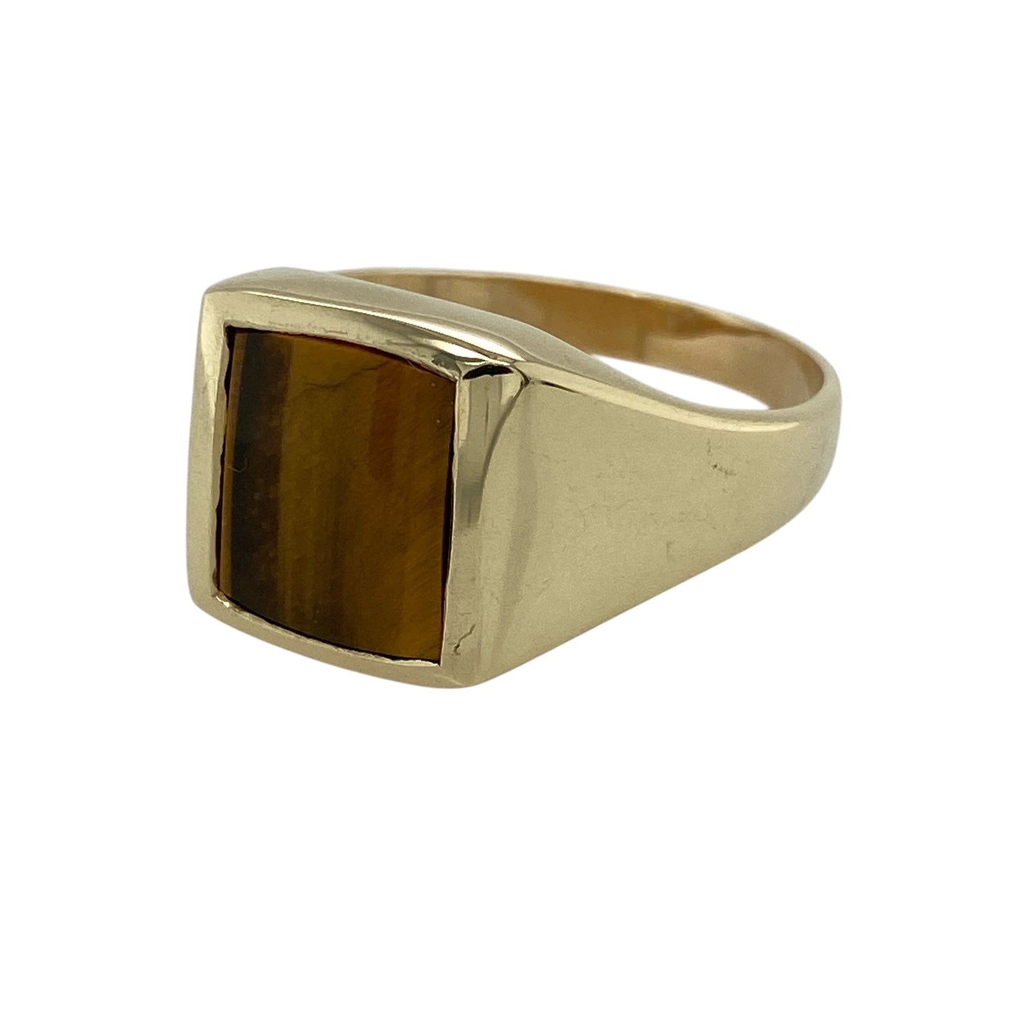 Make a bold statement with this pre-owned 9ct yellow gold tiger's eye signet ring, featuring a striking rectangular tiger's eye gemstone that combines timeless style with the classic appeal of a traditional signet ring.

Design: The ring showcases a polished rectangular tiger's eye stone measuring approximately 11mm by 9mm, creating a bold focal point with the gemstone's distinctive golden-brown chatoyant effect.