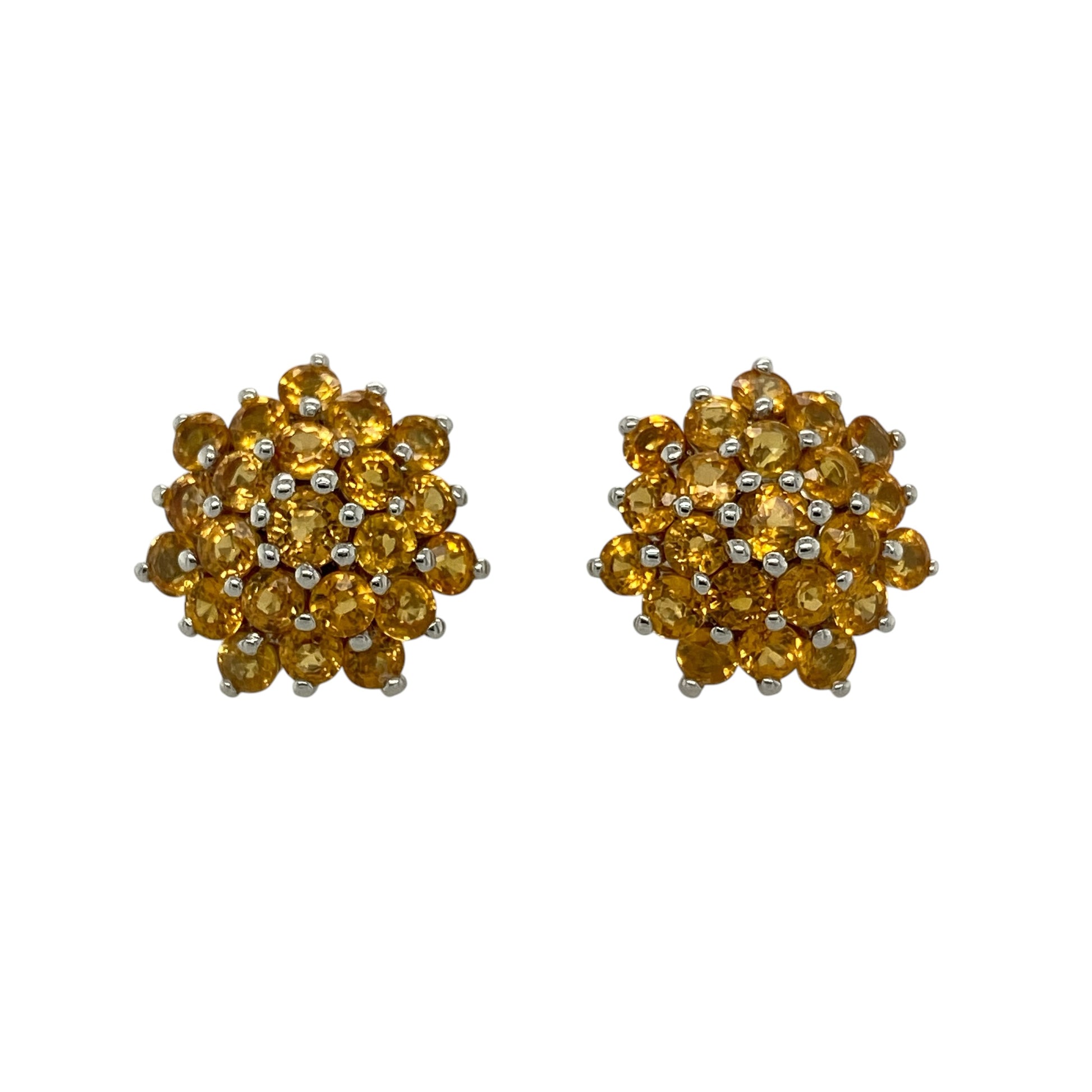 Add vibrant colour and timeless elegance to your jewellery collection with these pre-owned 9ct white gold citrine cluster stud earrings, featuring dazzling clusters of round citrine gemstones that create a bold and eye-catching look for any occasion.

Design: The earrings showcase impressive round clusters measuring approximately 15mm in diameter, each made up of multiple round citrine stones.