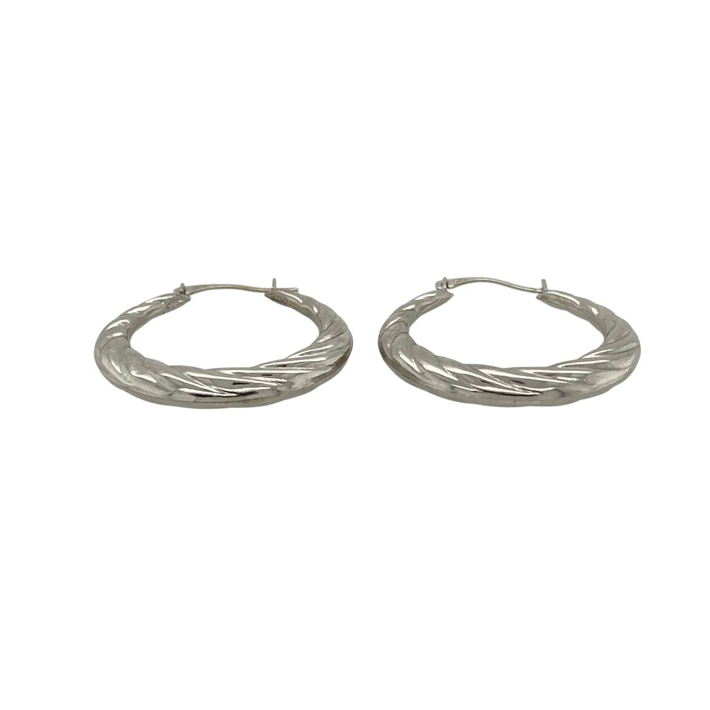 Add contemporary elegance to your jewellery collection with these pre-owned 9ct white gold twisted hoop creole earrings, featuring a timeless twisted design that catches the light beautifully and complements both everyday and occasion wear.

Design: The earrings feature a classic twisted hoop creole design, with the textured twist creating added depth and sparkle from every angle. Their elegant profile offers a modern take on a traditional hoop style.