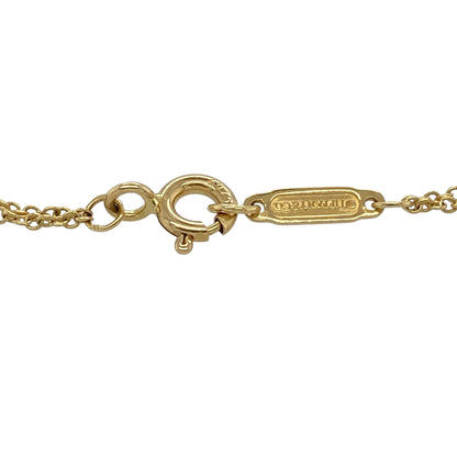 Celebrate timeless elegance with this pre-owned 18ct yellow gold infinity style bracelet, featuring a classic Tiffany-inspired infinity symbol that represents everlasting love, friendship and endless connection.

Design: The bracelet showcases a sleek infinity motif measuring approximately 20mm by 8mm, creating a simple yet elegant centrepiece. Its clean lines and minimalist styling make it perfect for everyday wear or layering with other bracelets.