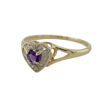 Add romantic elegance to your jewellery collection with this pre-owned 9ct yellow and white gold diamond and amethyst heart ring, featuring a beautiful heart-shaped amethyst accented with sparkling diamonds—perfect for everyday wear or as a meaningful gift.

Design: The ring showcases a stunning heart-shaped amethyst measuring approximately 4mm, creating a vibrant focal point with its rich purple colour.