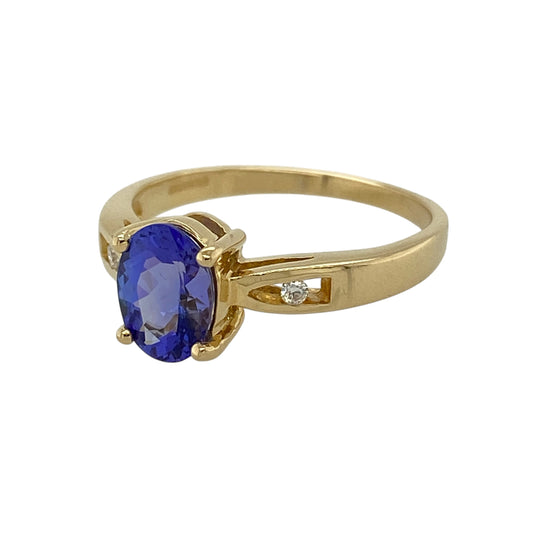 Add luxurious colour and timeless elegance to your jewellery collection with this pre-owned 18ct yellow gold diamond and tanzanite ring, featuring a stunning oval-cut tanzanite complemented by sparkling diamond accents—perfect for special occasions or everyday luxury.

Design: The ring showcases a beautiful oval-cut tanzanite measuring approximately 8mm by 6mm, displaying its captivating violet-blue colour.