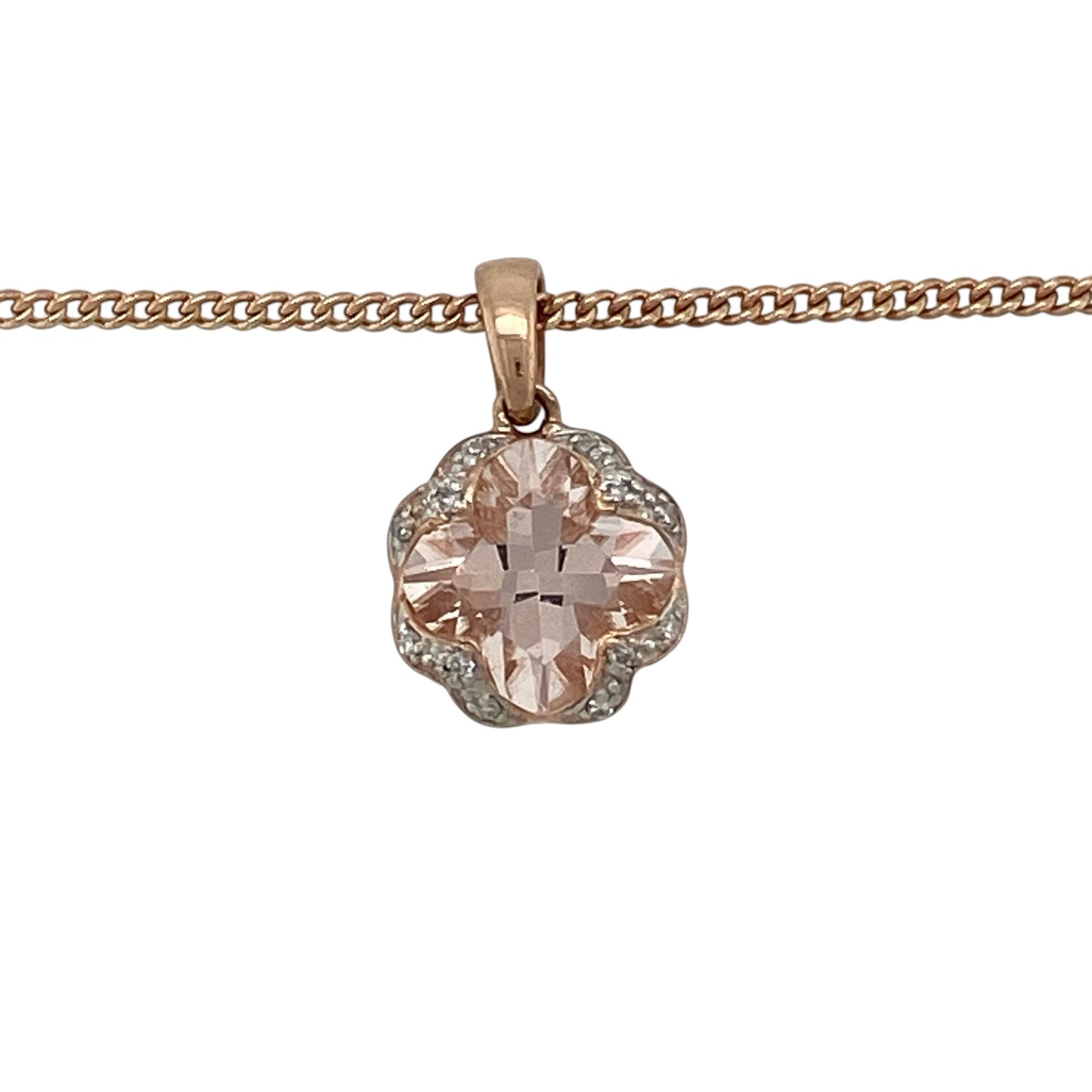 Add romantic elegance to your jewellery collection with this pre-owned 9ct rose gold diamond and morganite pendant necklace, featuring a stunning morganite centre stone with delicate diamond detailing in a beautiful floral-inspired design.

Design: The necklace showcases a round morganite measuring approximately 10mm in diameter, creating a captivating focal point with its soft blush-pink tones.