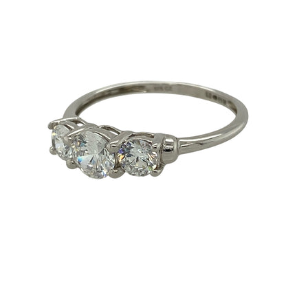 Add timeless sparkle to your jewellery collection with this pre-owned 9ct white gold cubic zirconia trilogy ring, featuring three dazzling stones in a classic trilogy design—perfect for everyday elegance or a meaningful gift.

Design: The ring showcases a brilliant round cubic zirconia centre stone measuring approximately 5mm in diameter, flanked by two matching round cubic zirconia stones measuring approximately 4mm each.