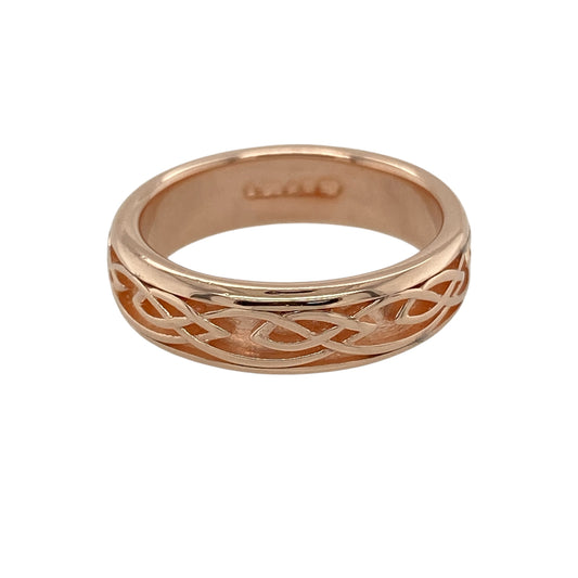 Add symbolic heritage and timeless style to your collection with this pre-owned 9ct rose gold Clogau Annwyl Celtic knot band ring—elegant, meaningful, and rich in Welsh tradition.

Design: The ring features an intricate Celtic knot pattern encircling the 5mm wide band, representing love, loyalty, and eternity.
Material: Made from 9-carat rose gold, the polished finish brings warmth and depth to the detailed knotwork, reflecting the signature Clogau craftsmanship.