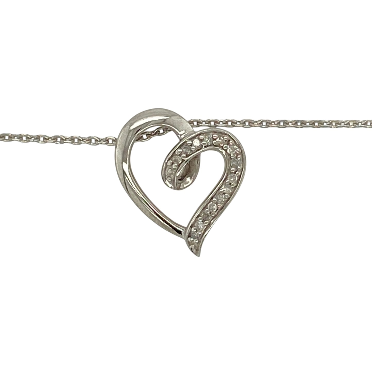 Add timeless sparkle and romantic elegance to your jewellery collection with this pre-owned 9ct white gold diamond open heart pendant necklace, featuring a classic open heart design adorned with sparkling diamonds—perfect for everyday wear or as a meaningful gift.

Design: The necklace features a beautifully proportioned open heart pendant measuring approximately 14mm by 13mm. Sparkling diamond accents enhance the elegant heart design, creating a timeless piece with graceful brilliance.