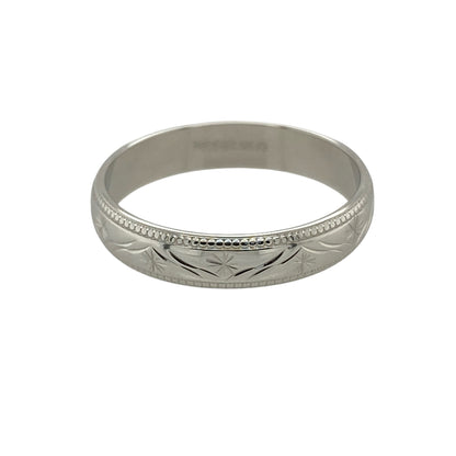 Celebrate timeless style with this pre-owned 9ct white gold patterned wedding band ring, featuring an elegant engraved finish that offers a classic yet distinctive look—perfect as a wedding band, commitment ring or everyday accessory.

Design: The ring features a 4mm wide band with an attractive patterned finish, creating subtle texture and visual interest while maintaining a timeless and versatile design. Its classic profile makes it suitable for both men and women.