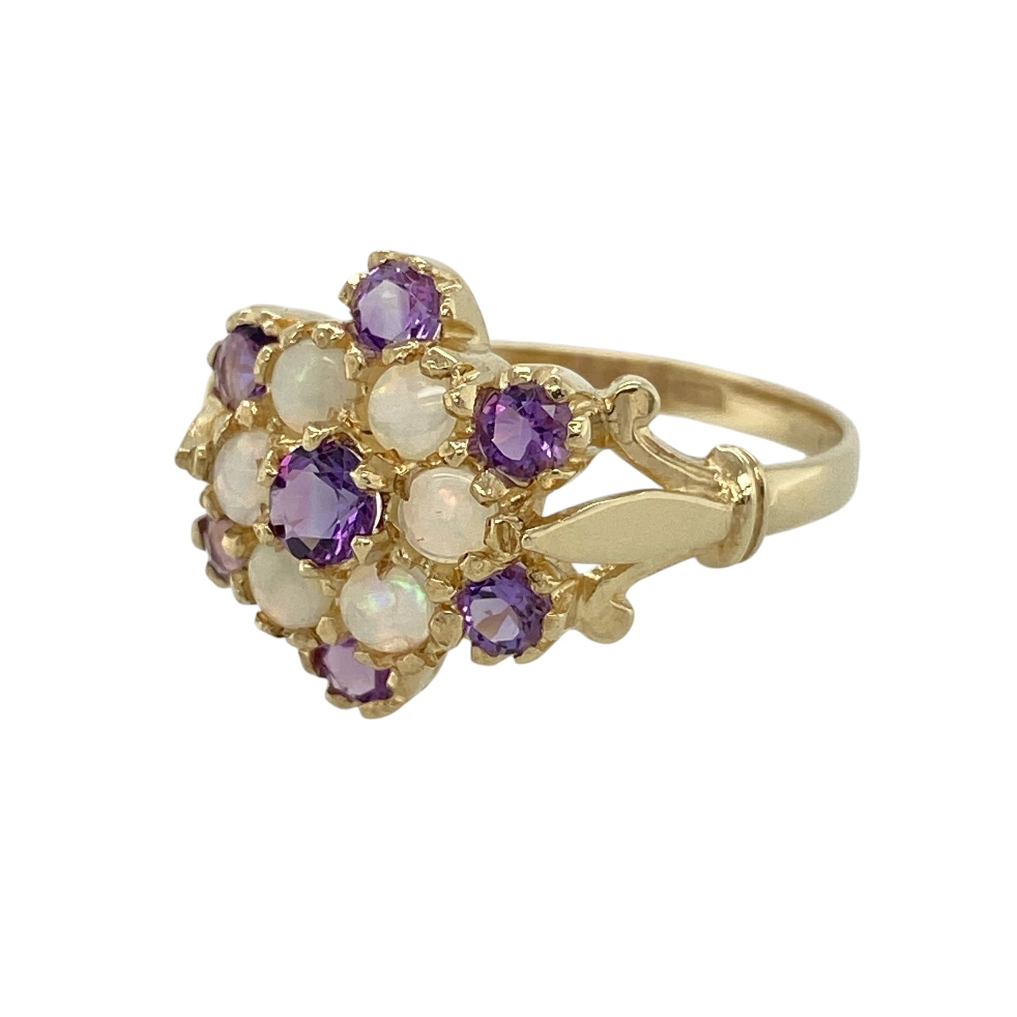 Add beautiful colour and vintage-inspired elegance to your jewellery collection with this pre-owned 9ct yellow gold amethyst and Opalique cluster ring, featuring a striking floral-inspired cluster design—perfect for special occasions or everyday wear.

Design: The ring showcases a beautiful cluster arrangement measuring approximately 14mm across the front, combining rich purple amethyst with shimmering Opalique stones to create a striking and elegant focal point.