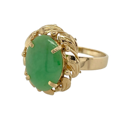 Add timeless elegance to your jewellery collection with this pre-owned 14ct yellow gold jade ring, featuring a beautiful oval jade gemstone framed by an intricate twisted surround—perfect for everyday wear or special occasions.

Design: The ring showcases a striking oval jade gemstone measuring approximately 13mm by 9mm, beautifully framed by a decorative fancy twisted surround that enhances the natural beauty of the stone. The classic design offers a sophisticated look with vintage-inspired charm.
