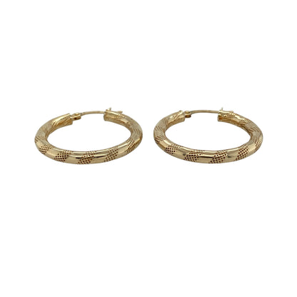Add timeless style to your jewellery collection with these pre-owned 9ct yellow gold stripe patterned hoop creole earrings, featuring a classic hoop design with elegant textured detailing—perfect for everyday wear or special occasions.

Design: These earrings feature a traditional hoop creole style with an attractive stripe-patterned finish that catches the light beautifully. Measuring approximately 25mm in diameter, they offer a versatile medium-sized profile that is both stylish and easy to wear.
