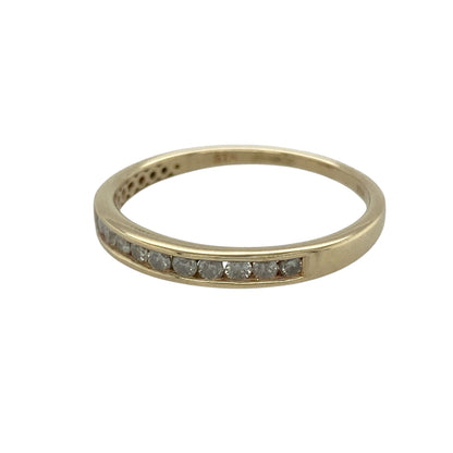 Add timeless sparkle to your jewellery collection with this pre-owned 9ct yellow gold diamond band ring, featuring a sleek design set with approximately 0.30ct of diamonds for elegant everyday wear or special occasions.

Design: The ring showcases a refined band with a front measuring approximately 3mm wide, beautifully set with sparkling diamonds that create a continuous line of brilliance across the finger.