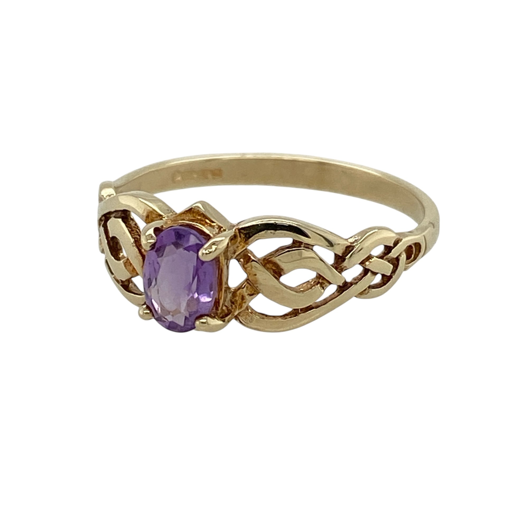 Celebrate timeless Celtic craftsmanship with this pre-owned 9ct yellow gold amethyst Celtic ring, featuring a beautiful oval amethyst framed by elegant Celtic knot shoulders for a meaningful and distinctive design.

Design: The ring showcases a vibrant oval-cut amethyst measuring approximately 6mm by 4mm, creating a striking focal point. Intricately crafted Celtic knot detailing adorns the shoulders, adding symbolic beauty and enhancing the classic gemstone setting.