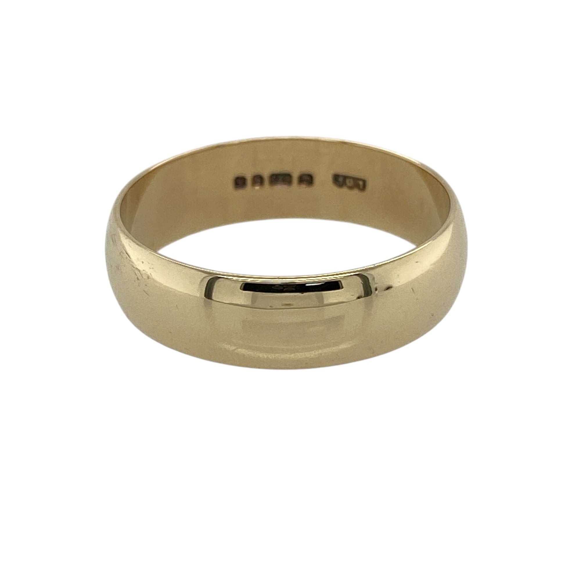 Celebrate timeless simplicity with this pre-owned 9ct yellow gold wedding band ring, featuring a classic 5mm polished profile that offers enduring style and everyday comfort.

Design: The ring features a traditional plain wedding band with a smooth, polished finish and a generous 5mm width. Its clean, understated design makes it a timeless choice, whether worn as a wedding ring, commitment band or everyday piece of jewellery.