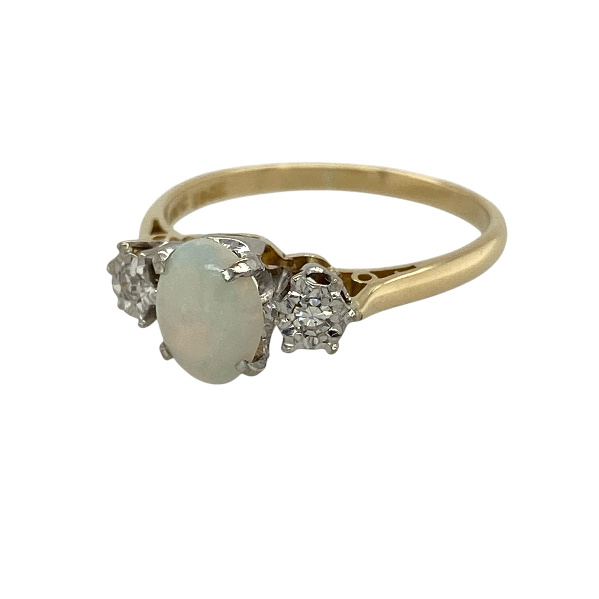 Discover timeless elegance with this pre-owned 18ct yellow gold diamond and opal trilogy ring, featuring a captivating oval opal beautifully complemented by sparkling diamonds in a classic three-stone design.

Design: The ring showcases a stunning oval opal measuring approximately 8mm by 6mm, displaying the enchanting play of colour that makes opal so highly prized. A sparkling diamond is set on either side of the centre stone, creating a balanced trilogy design that symbolises the past, present and future.
