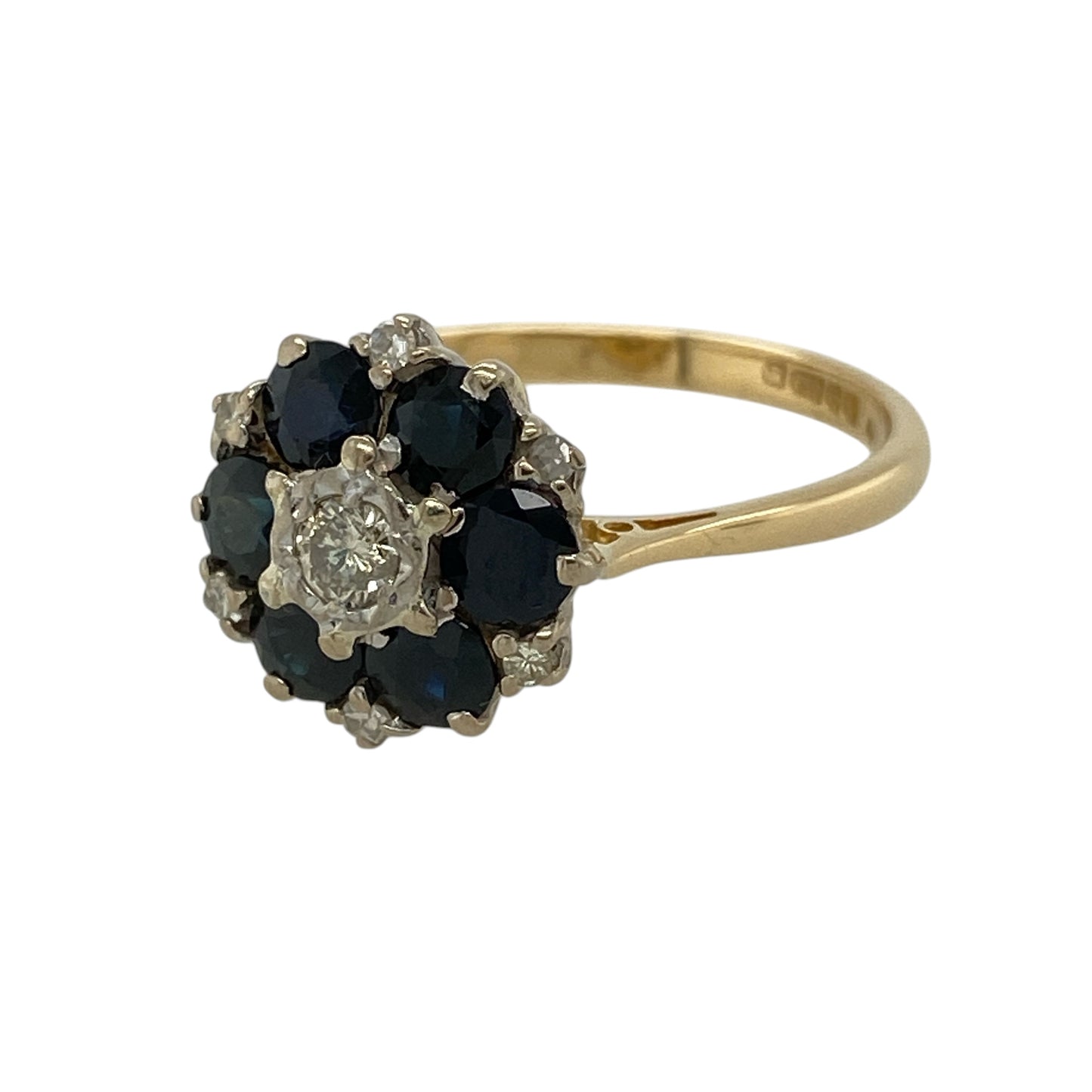 Make a striking statement with this pre-owned 18ct yellow gold diamond and sapphire cluster ring, featuring a luxurious floral-inspired cluster of rich blue sapphires and sparkling diamonds.

Design: The ring showcases an elegant cluster design measuring approximately 13mm high across the front. A sparkling central diamond is surrounded by deep blue sapphires, with additional smaller diamonds set between the sapphires to enhance the brilliance and create a beautifully balanced, eye-catching display.