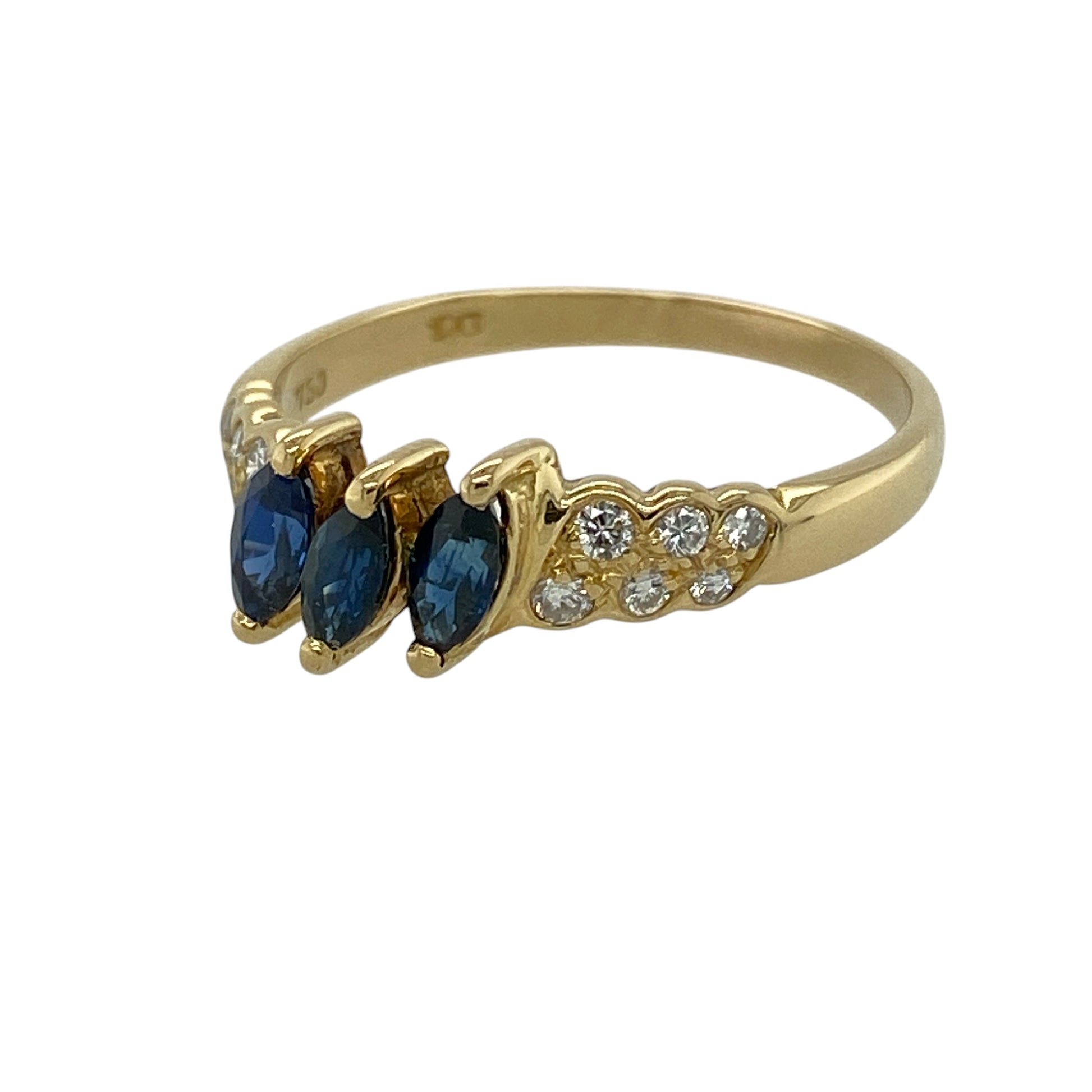 Celebrate timeless elegance with this pre-owned 18ct yellow gold diamond and sapphire trilogy ring, featuring three marquise-cut sapphires complemented by sparkling diamond-set shoulders.

Design: The ring showcases three elegant marquise-cut sapphires, each measuring approximately 5mm by 2mm, arranged in a classic trilogy setting that symbolises the past, present and future. Sparkling diamonds adorn the shoulders, adding extra brilliance and enhancing the graceful silhouette of the ring.