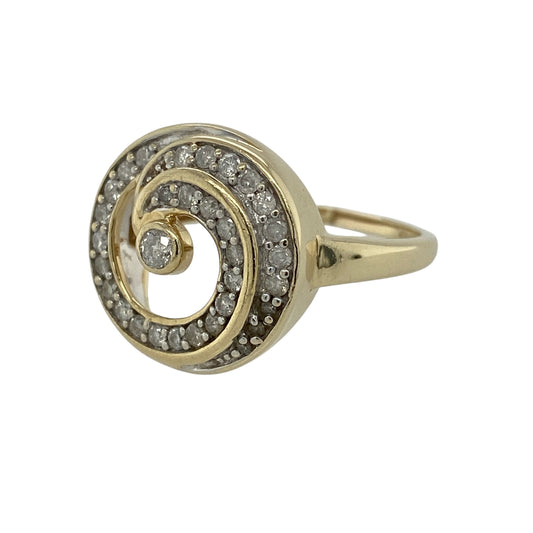 Make a sophisticated statement with this pre-owned 9ct yellow gold diamond swirl ring, featuring an elegant flowing design set with sparkling diamonds for timeless appeal.

Design: The ring showcases a graceful swirl motif across the front, with flowing curves beautifully accented by sparkling diamonds. Measuring approximately 16mm high at the front, the sweeping design creates an eye-catching statement while maintaining an elegant and feminine appearance.