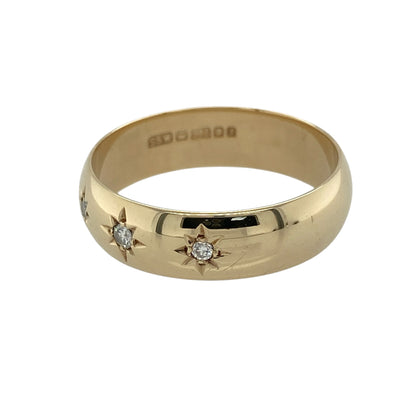 Celebrate timeless style with this pre-owned 9ct yellow gold diamond starburst set trilogy wedding-style band ring, featuring three sparkling diamonds in traditional starburst settings across a substantial polished band.

Design: The ring showcases three diamonds arranged in a classic trilogy formation, each beautifully highlighted by traditional starburst-style settings that enhance their sparkle.