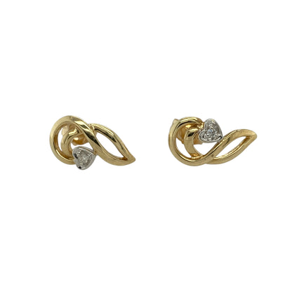Add a touch of romance to your jewellery collection with these pre-owned 9ct yellow and white gold diamond heart swirl stud earrings, featuring an elegant two-tone heart design with sparkling diamond accents.

Design: These beautifully crafted stud earrings showcase an elegant heart motif with a graceful swirl design, combining polished yellow and white gold for a sophisticated two-tone finish. Sparkling diamond accents add a subtle touch of brilliance, enhancing the romantic and contemporary styling.