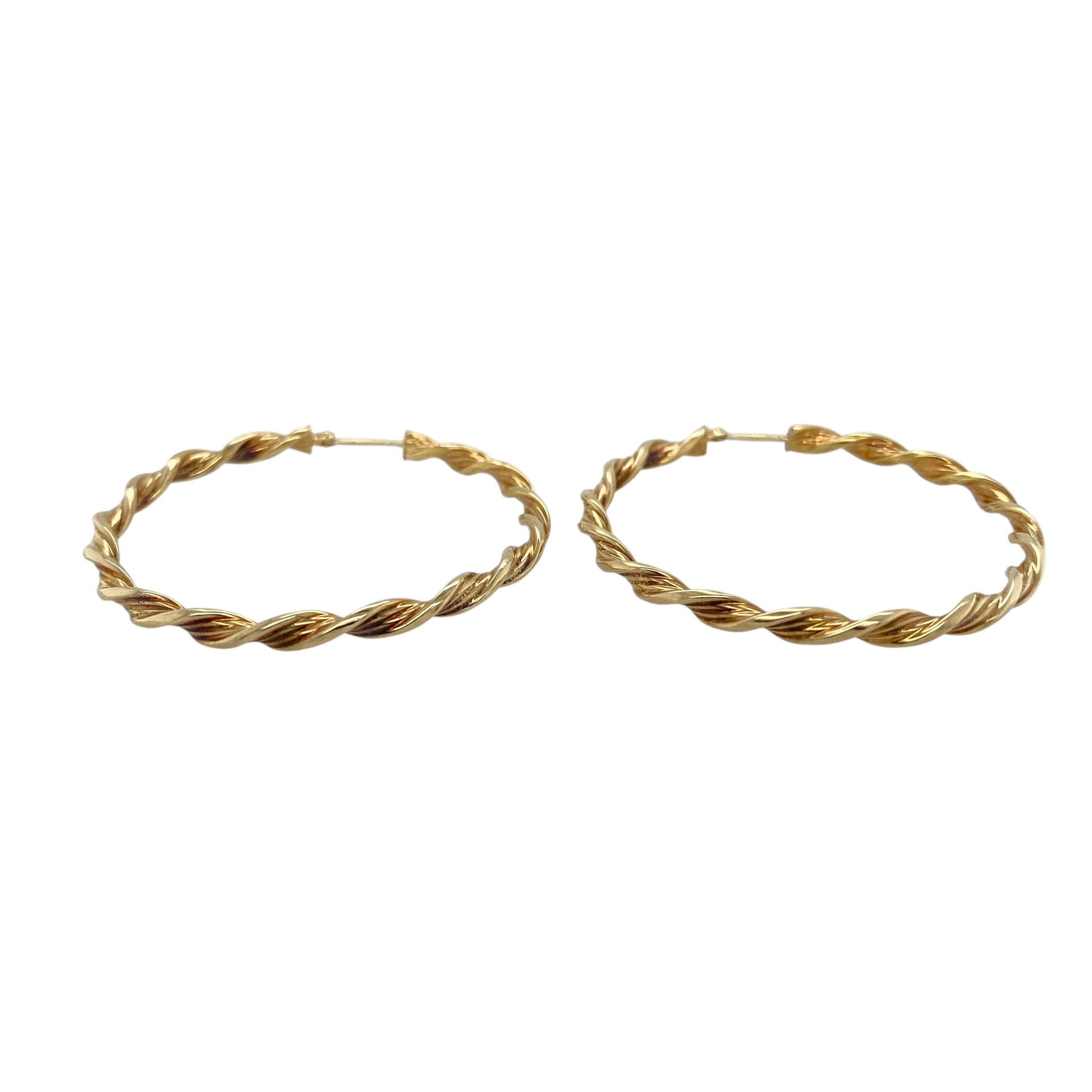 Add timeless style to your jewellery collection with these pre-owned 9ct yellow gold twisted hoop creole earrings, featuring a classic design enhanced by elegant textured movement.

Design: These stylish creole earrings showcase a twisted hoop design that adds depth and visual interest to the classic circular silhouette. The flowing twist detail catches and reflects the light beautifully, creating an eye-catching appearance suitable for everyday wear or special occasions.
