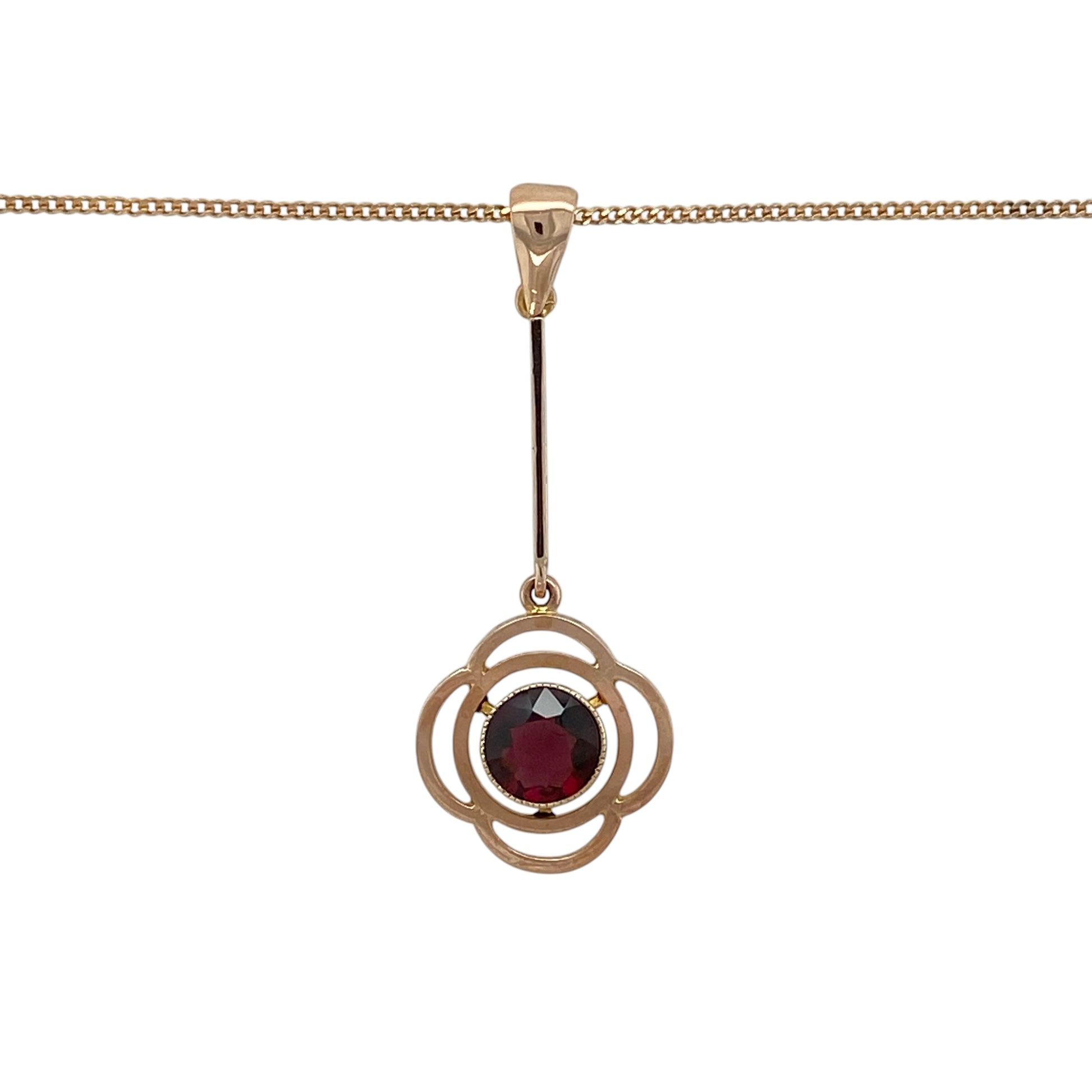 Add romantic vintage-inspired elegance to your jewellery collection with this pre-owned 9ct rose gold ruby flower drop pendant necklace, featuring a beautiful floral design and rich red gemstone centrepiece.

Design: The necklace showcases an elegant vintage-style flower drop pendant set with a striking round ruby measuring approximately 6mm in diameter.