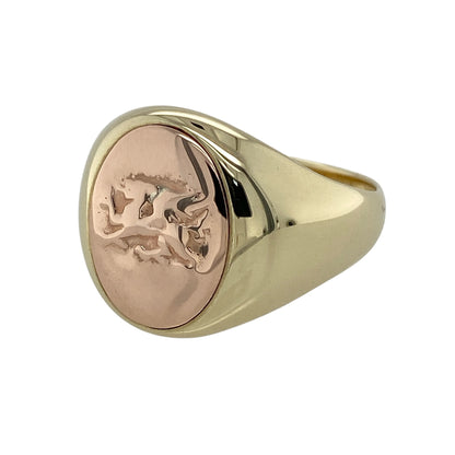 Celebrate Welsh heritage with this pre-owned 9ct yellow and rose gold Clogau Welsh Dragon oval signet ring, featuring the iconic Welsh Dragon in a bold signet design that combines timeless style with meaningful symbolism.

Design: The ring showcases a striking oval signet face measuring approximately 17mm high, featuring the famous Welsh Dragon motif in contrasting rose gold. The bold design creates an impressive statement while reflecting the distinctive style associated with Clogau jewellery.