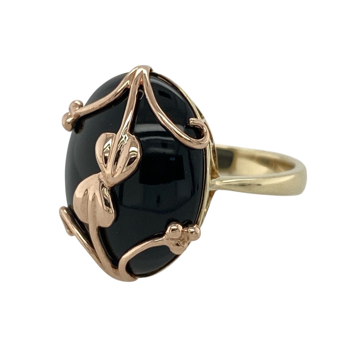 Celebrate Welsh heritage with this pre-owned 9ct yellow and rose gold Clogau Tree of Life ring, featuring a striking black onyx centrepiece beautifully engraved with the iconic Tree of Life vine motif.

Design: This elegant ring showcases a large oval black onyx stone measuring approximately 19mm by 14mm, creating a bold and sophisticated focal point.