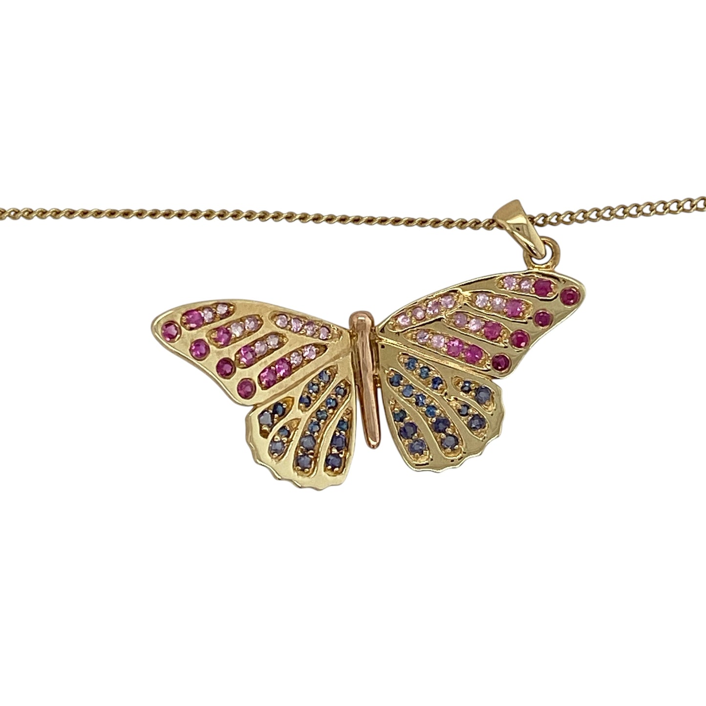 9ct yellow gold Clogau pink and blue gemstone-set butterfly pendant necklace, complete with a matching 18-inch Clogau curb chain.

Design: The necklace showcases an elegant butterfly pendant set with beautiful pink and blue gemstones, creating an eye-catching combination of colour and sparkle. The delicate butterfly motif gives the piece a graceful, feminine appearance, while the detailed design reflects the nature-inspired styling associated with Clogau jewellery.